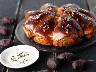 Close up.Fried rolls with chocolate filling on a dark wooden table.
