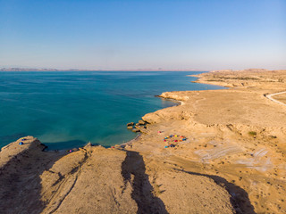 Fototapeta na wymiar Aerial view of campsites near the ocean in the island of Hengam in Iran