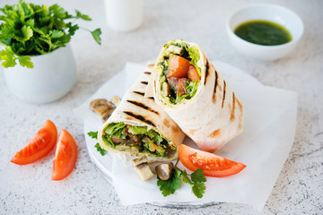 Burritos wraps with mushrooms and vegetables, a traditional Mexican food.