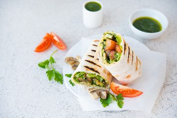 Burritos wraps with mushrooms and vegetables, a traditional Mexican food. Copy space