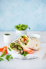 Burritos wraps with mushrooms and vegetables, a traditional Mexican food.