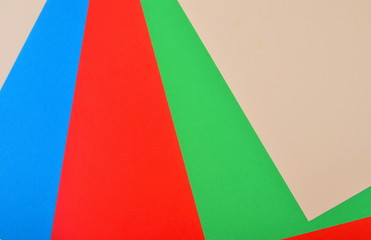 Obraz premium Red, green, blue and cream colored papers. Colored Papers Sheets Illustration background material design