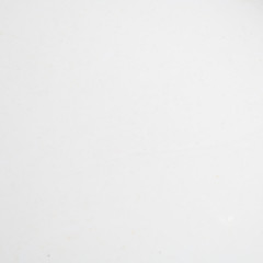 White blurred background with small snowflakes