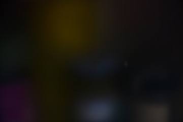 Colorful dark blurred background with spots, lines and patterns