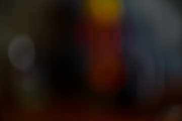 Colorful dark blurred background with spots, lines and patterns