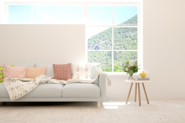 White living room with sofa and summer landscape in window. Scandinavian interior design. 3D illustration