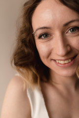 portrait of a young woman smiling  close up