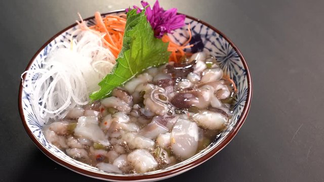 Japanese food tako wasabi appetizer dinner meal on a turn table .