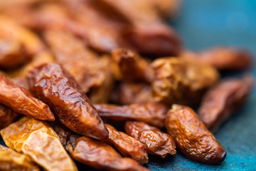 Detail of dried cayenne to add spice to food. Blue dark background