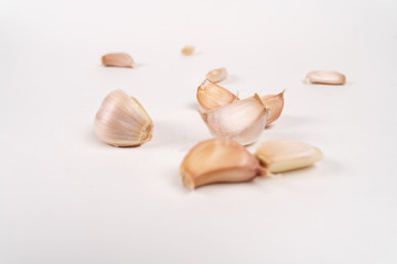 Fototapeta na wymiar garlic lies on a white table. white background