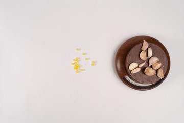 Yellow vitamins and garlic on kitchen eyelids