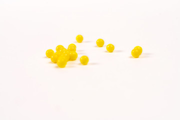 yellow tablets scattered on the table. healthe