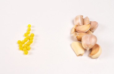 Yellow vitamins and garlic on kitchen eyelids
