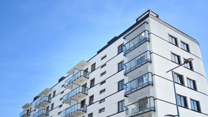 Modern condo building with big windows and modern facade.