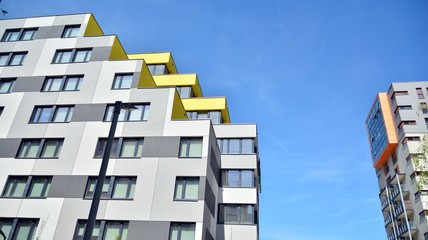 Modern condo building with big windows and modern facade.