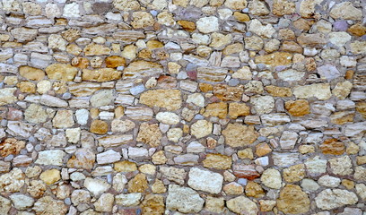 Natural stones, quarry stones as a protective wall. Background, texture, closeup, full frame, 
