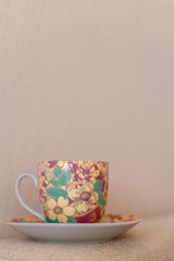 porcelain tea cup on textile background