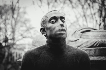 Black man smoking on street