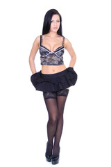 Portrait of a young beautiful brunette woman in black skirt