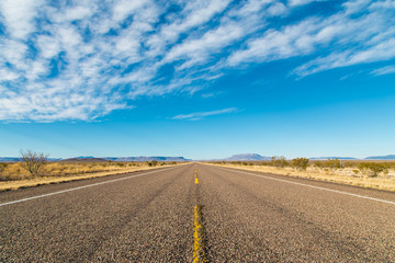 Fototapeta na wymiar A Lonely Long Road with a Stunning Scenic Landscape View