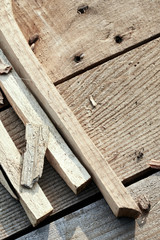 wooden background. The dotches and sawdust lie on the village table. composition from pieces of wood. solar lighting