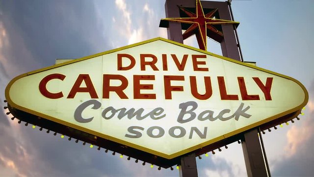 evening clouds over the DRIVE CAREFULLY sign Las vegas 