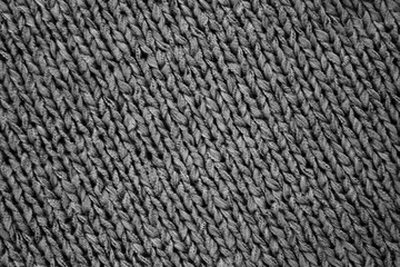 Knitted texture saturated dark grey. Background template for design banner, poster, wallpaper. Saturated grey background. High quality photo