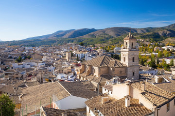 Fototapeta na wymiar Panorama of the city of Caravaca de la Cruz with many houses with tiled roofs, a place of pilgrimage near Murcia in Spain