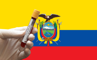 COVID-19 Pandemic Coronavirus concept ; Close-up of a Positive COVID-19 blood test sample tube with Flag of Ecuador at background. Blood testing for diagnosis new Corona virus infection.