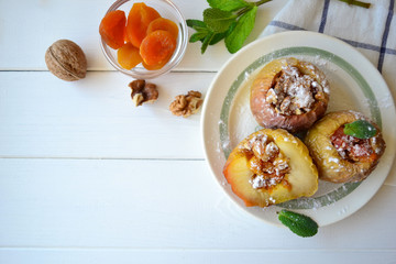 Baked apples filled with dried apricots and nuts.