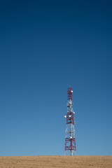 Obraz premium Telecommunication tower with clear blue sky