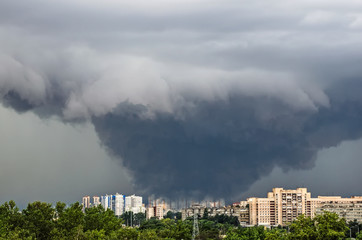 Huge wide powerful catastrophic tornado in a densely populated city power on a scale of F3, EF4-5.