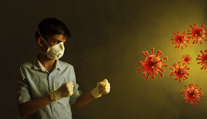 Portrait of young  Indian boy wearing protective mask and fighting against the coronavirus