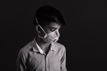 Portrait of young  Indian boy wearing protective mask against the coronavirus