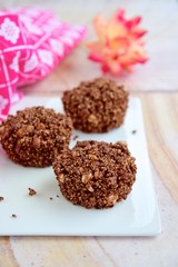 Healthy dessert chocolate cups with puffed quinoa and amaranth, cocoa powder, almond butter, maple syrup and coconut butter