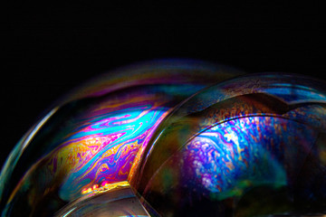 Set of soap bubbles isolated on black background. Studio Shot. With copy space text.