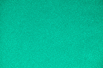 Green embossed background with abstract pattern