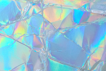 Blurred abstract Modern pastel colored holographic background in 80s style. Crumpled iridescent...