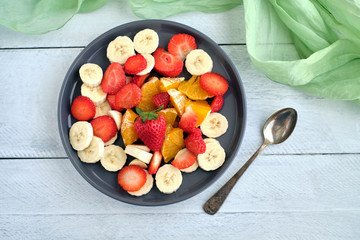 Macedonia fruit from above on rustic wooden table