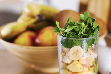 crushed fruit for smoothie. Different tropical fruits and smoothie on table on home kitchen background, healthy eating lifestyle concept. selective focus.