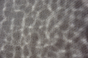 Speckled grey and white abstract pattern woven background