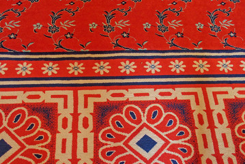  original background from a red carpet in a mosque close-up