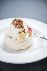 Pavlova cake with berries, vanilla, chocolate