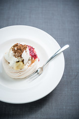 Pavlova cake with berries, vanilla, chocolate