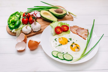 Fototapeta na wymiar Delicious and healthy breakfast - fried egg and vegetable salad