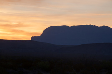 Sunset in the desert with mountains
