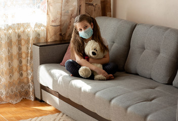
masked girl with teddy bear