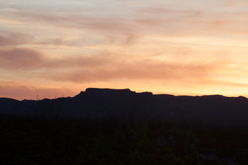 Sunset in the desert with mountains