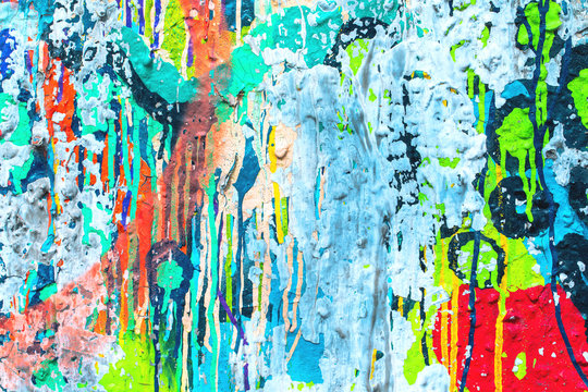 Fototapeta Closeup of colorful messy painted urban wall texture. Modern pattern for wallpaper design. Creative urban city background. Abstract open composition.