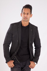 Handsome man in black shirt and jacket looking thoughtful